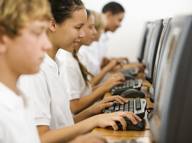 School children sat on computers